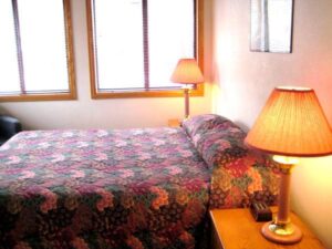Condo A08 - Bedroom With Queen Bed And Nightstands 2 | Alpenglow Vacation Rentals Ouray