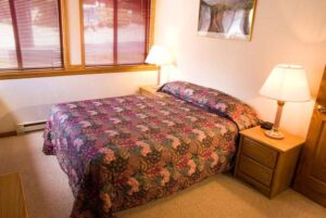 XL Condo A16 - Bedroom With Queen Bed And Nightstands | Alpenglow Vacation Rentals Ouray