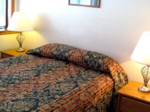 XL Condo A17 - Bedroom With Queen Bed And Nightstands 2 | Alpenglow Vacation Rentals Ouray