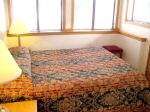 XL Condo A17 - Bedroom With Queen Bed And Nightstands | Alpenglow Vacation Rentals Ouray