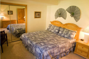 Condo C03 - Bedroom With King Bed And Nightstand | Alpenglow Vacation Rentals Ouray