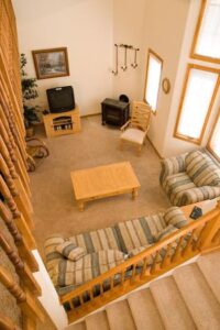 Condo C03 - A View On Living Room From Stairs | Alpenglow Vacation Rentals Ouray