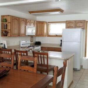 Condo C07 - Second Floor Dining Area and Kitchen | Alpenglow Vacation Rentals Ouray