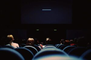 People watching a movie in cinema | Alpenglow Vacation Rentals Ouray